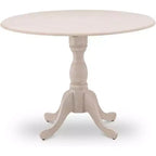 Table à manger en bois d'acacia offrant une texture boisée avec deux rallonges abattantes de 23 cm