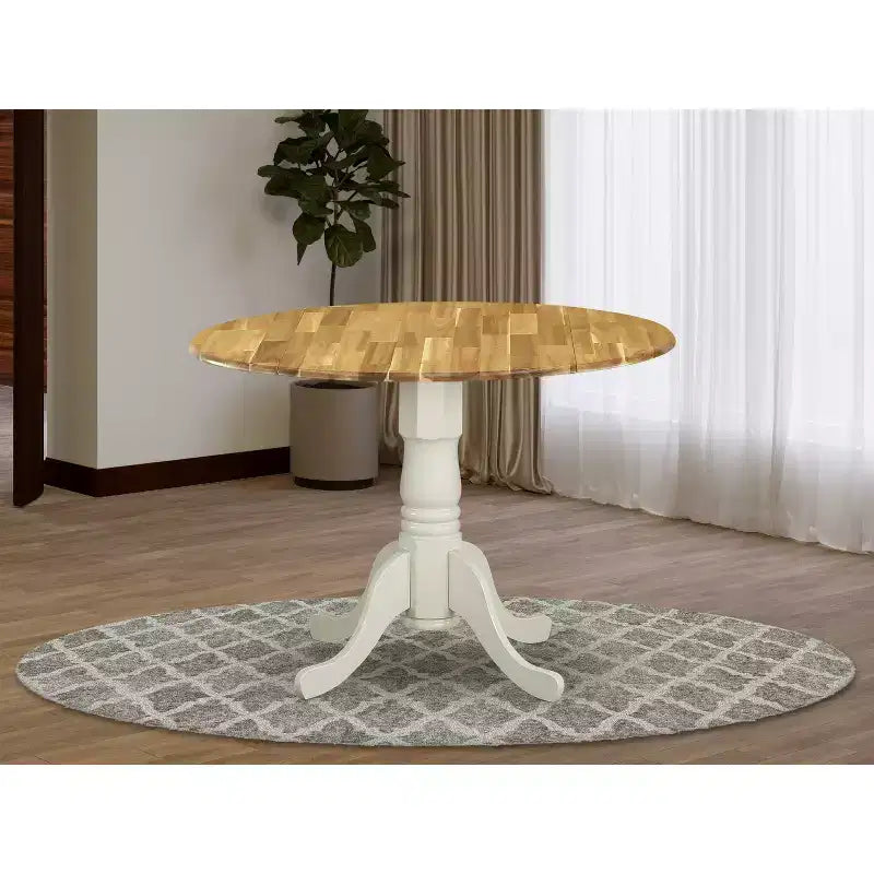 Table à manger en bois d'acacia offrant une texture boisée avec deux rallonges abattantes de 23 cm